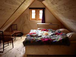 Schlafzimmer im Holzhaus